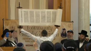 Woman slain in California synagogue attack honored with Torah scroll