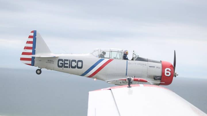 Geico Skytypers pay tribute to American troops with Statue of Liberty fly-by
