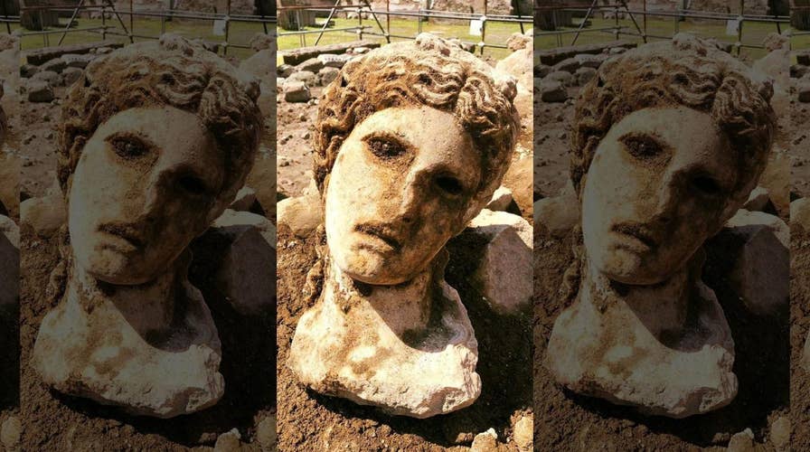 Ancient marble head depicting Greek god Dionysus discovered in Rome