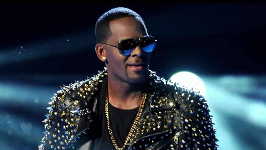 R. Kelly charged with 11 new sex-related counts
