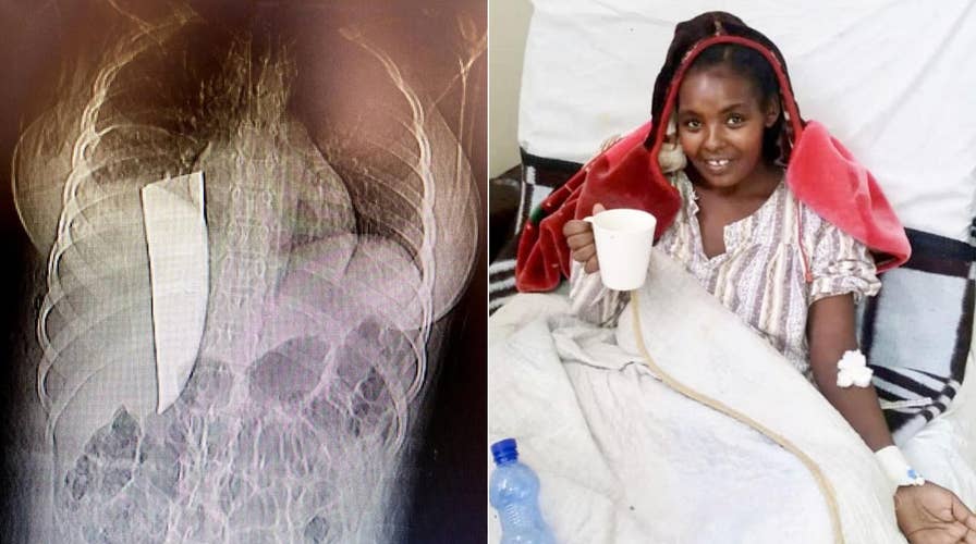 Woman allegedly had 11-inch knife in back for over a week