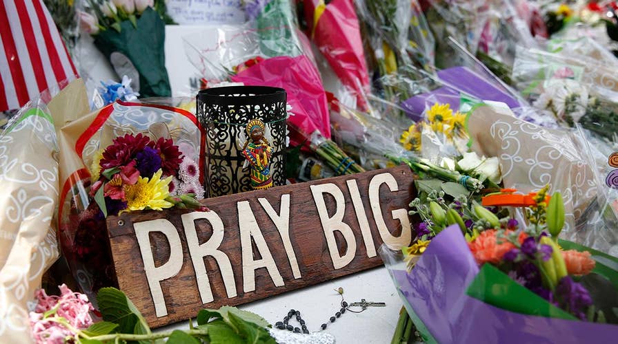 Virginia Beach shooting memorial grows larger by the hour as police probe shooter's motives