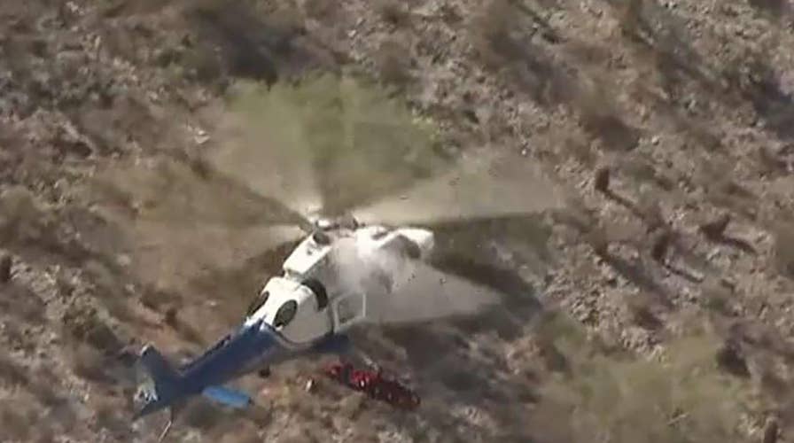 Helicopter rescue gurney spins out of control while rescuing injured hiker