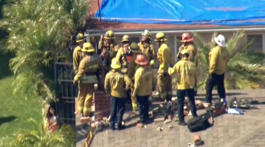 Raw video: Teenager rescued from chimney by LA County firefighters