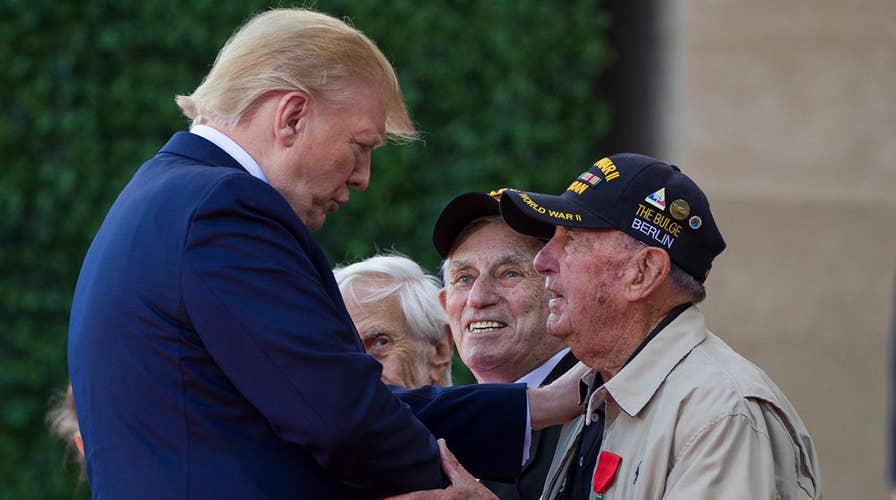 World leaders pay a solemn tribute to veterans to commemorate the 75th anniversary of D-Day