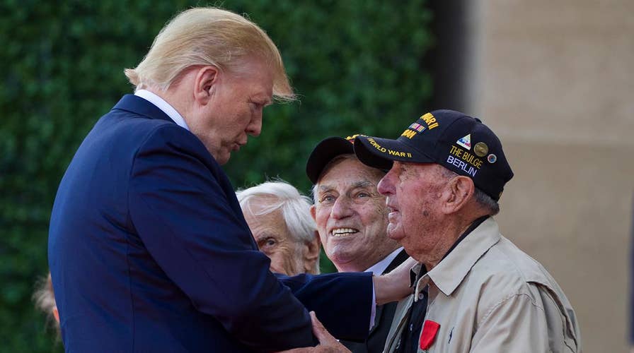 World leaders pay a solemn tribute to veterans to commemorate the 75th anniversary of D-Day