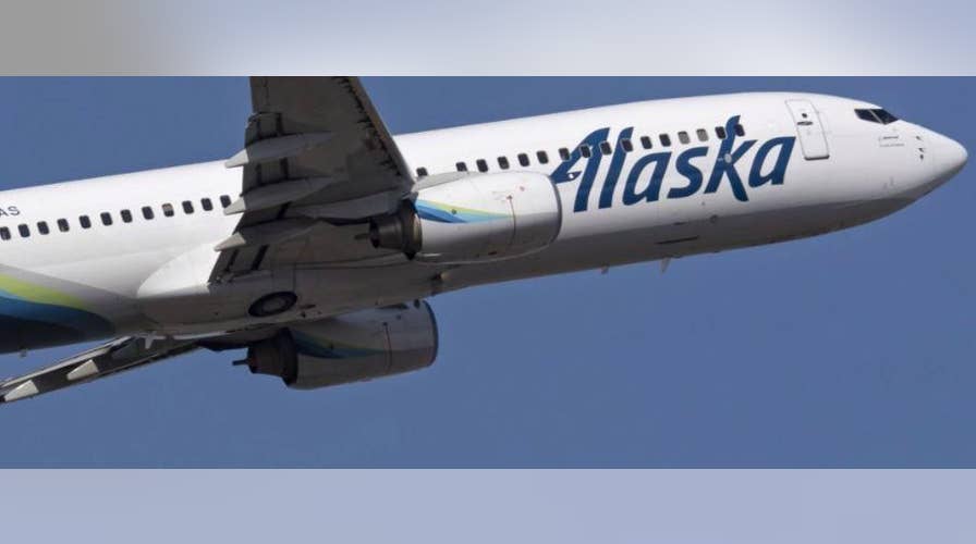 Alaska Airlines investigating incident after worker recorded hurling bags from plane