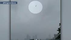 Video appears to show helicopter flying erratically before high-rise crash in New York City