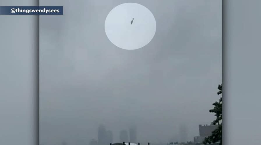 Helicopter seen flying erratically over the East River in New York City
