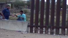 Footage of porous US-Mexico border purportedly shows armed coyote smuggling dozens with ease