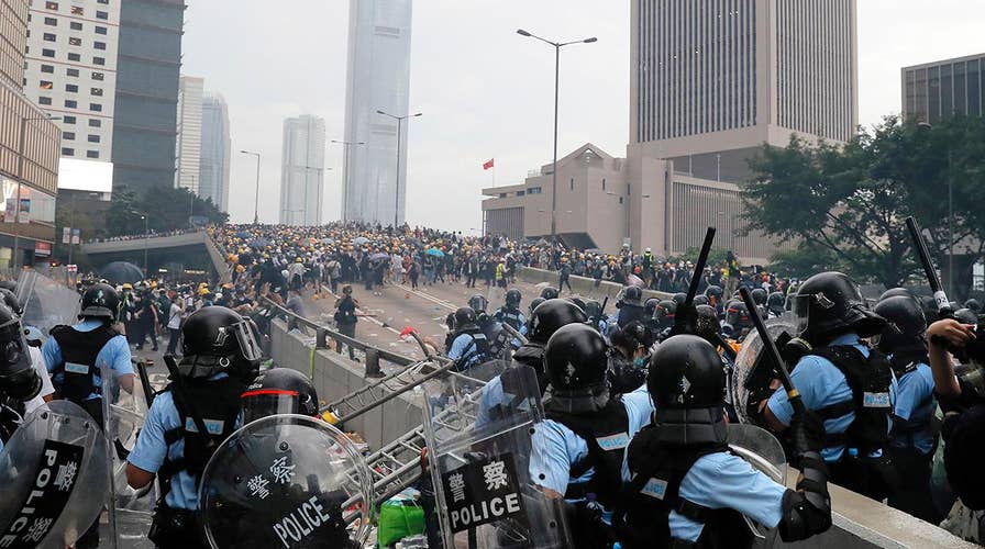 Thousands of demonstrators surround government buildings in Hong Kong, protest against extradition bill