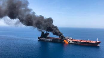 Trump blames Tehran for Gulf tanker attacks after Navy releases video showing Iranian boat removing unexploded mine