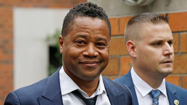 Cuba Gooding Jr. turns himself in to police after woman accuses him of groping her at New York City bar