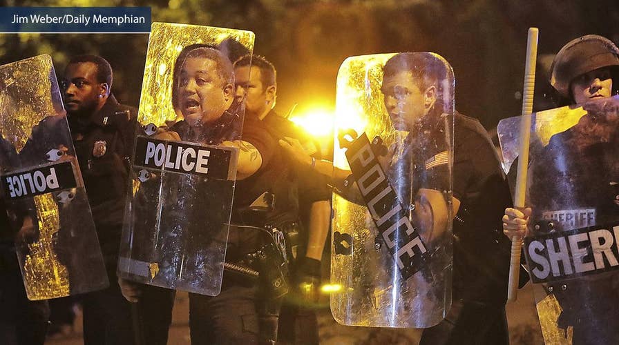 Demonstrators smashing cop car during violent riots in Memphis