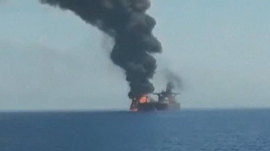 Oil tanker damaged in suspected attack burns in the Gulf of Oman