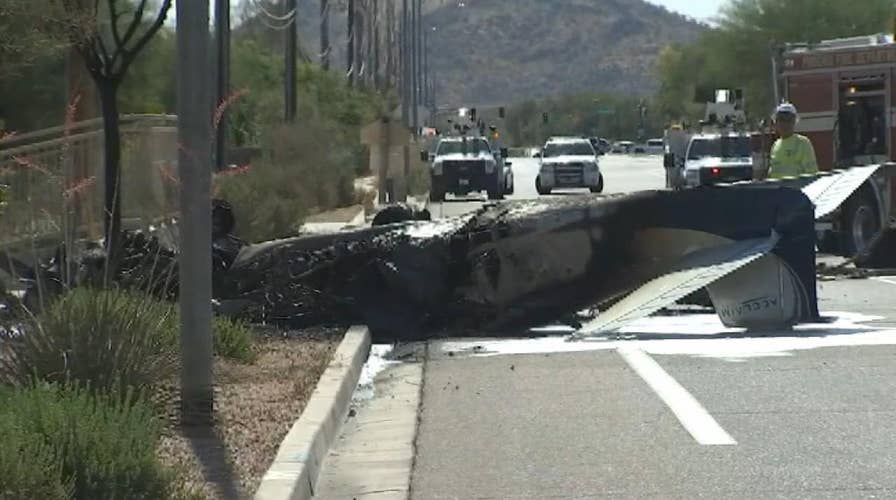 Good Samaritans pull injured pilot from burning plane that crash-landed on road in Arizona