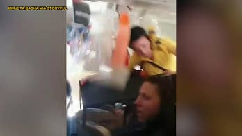 Video shows flight attendant hitting plane ceiling, passenger praying during severe turbulence