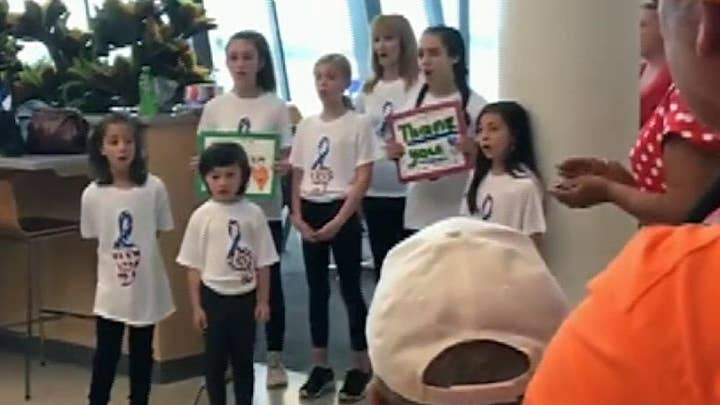 Veterans returning from D.C. greeted by crowd singing 'God Bless America'