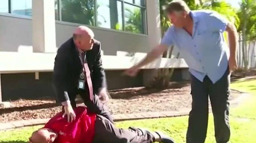 Australian police detective stops news conference to tackle fleeing suspect