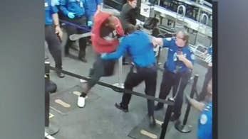 Footage from TSA attack at Phoenix airport shows suspect charging through checkpoint, punching officers