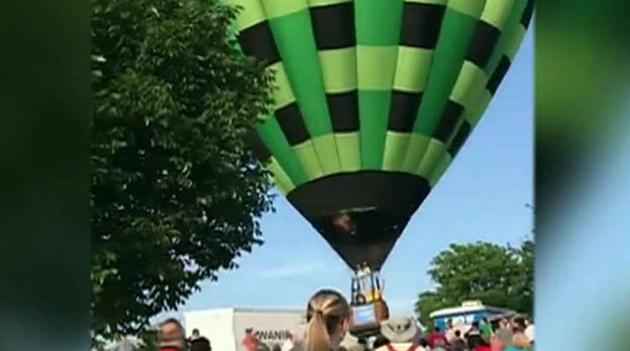 Hot air balloon flies through crowd at Missouri festival