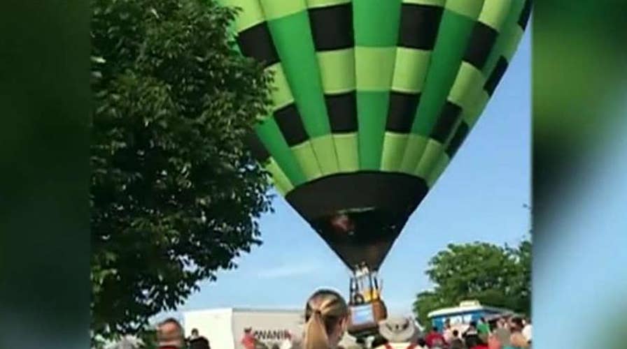 Hot air balloon flies through crowd at Missouri festival