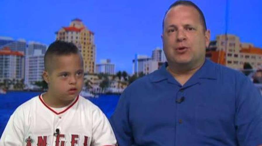 Angels' Albert Pujols signs and gives his jersey to young baseball fan with Down syndrome