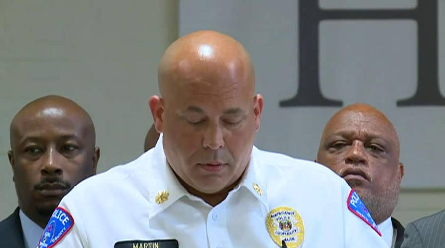 Police in Pine Lawn, Missouri brief the press on the fatal shooting of an officer
