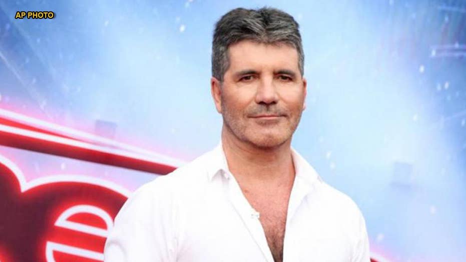 Simon Cowell Hurts Back Hospitalized After Electric Bike Crash