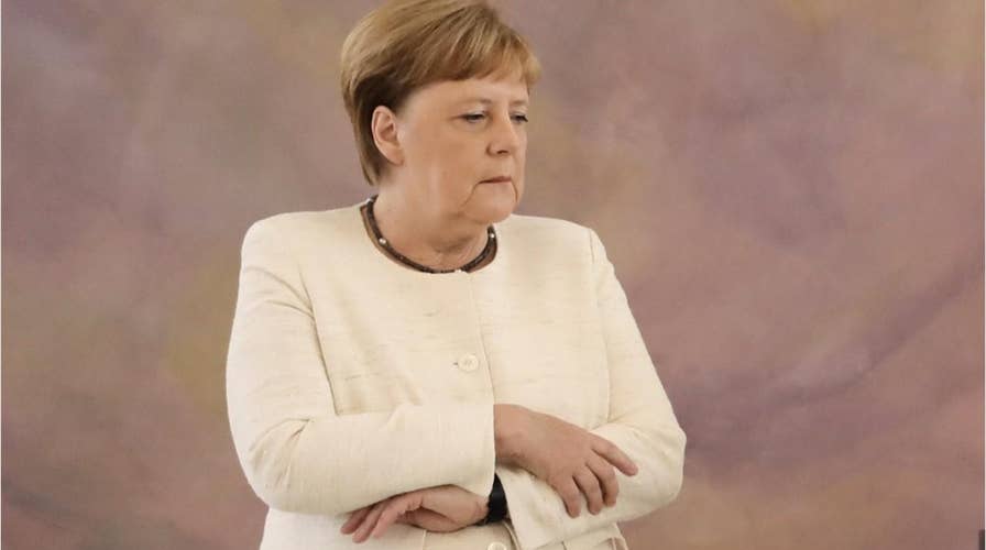 Angela Merkel seen shaking at event in Berlin