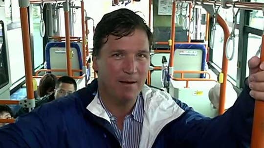 Tucker Carlson takes a bus in Japan