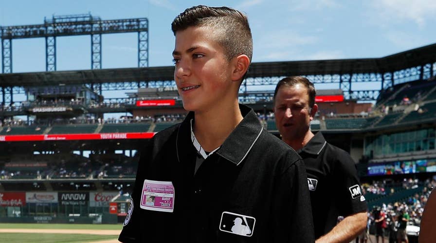 Teen umpire at center of baseball brawl honored at MLB game