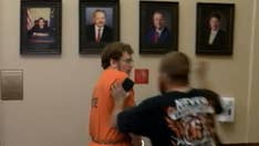 Indiana father convicted of killing 3-month-old son punched in the face in court