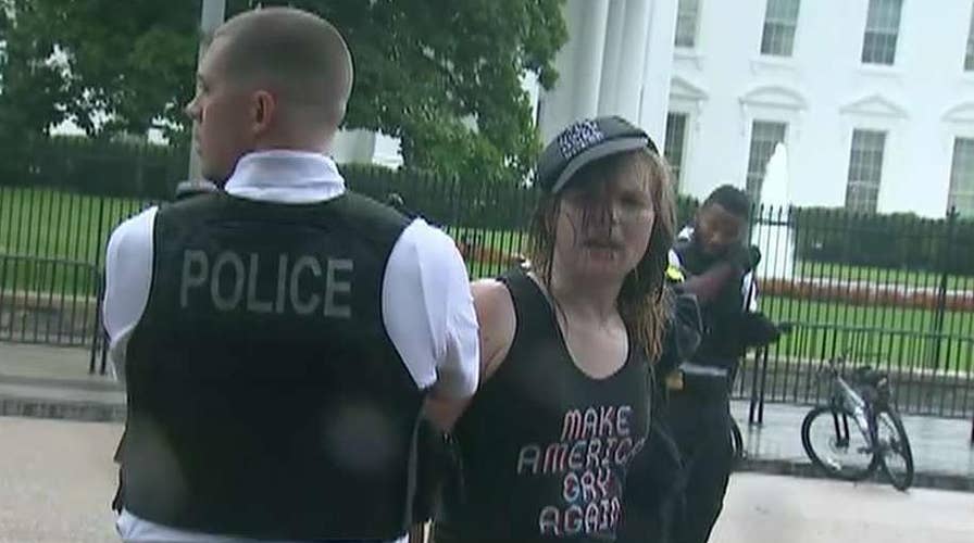 Two protesters arrested after flag burning, scuffle near White House