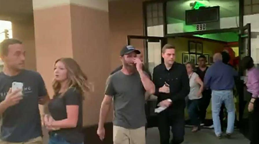 Panicked diners rush from a restaurant as a 7.1-magnitude earthquake hits Southern California