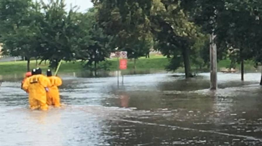 First responders save sleeping man from rising waters