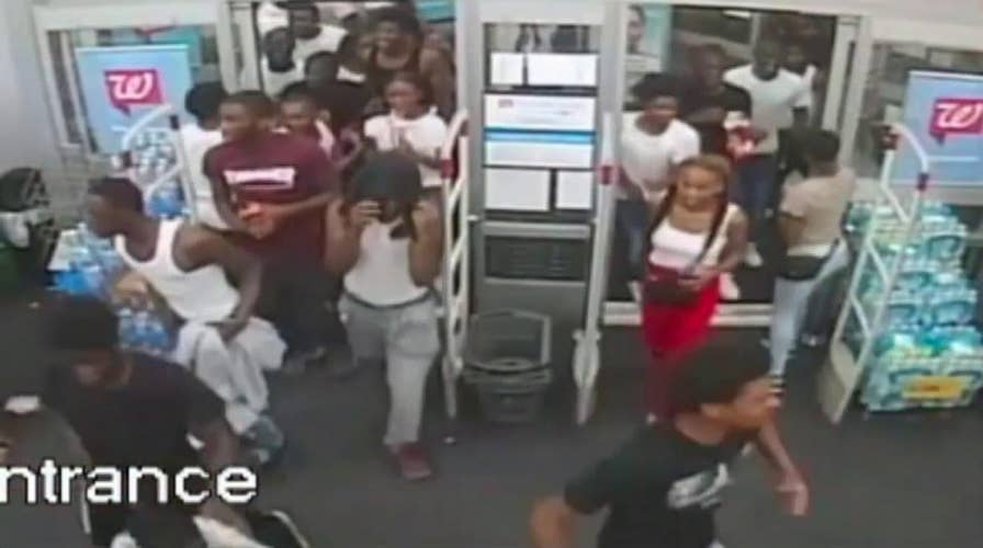 Philadelphia police release video to help apprehend 60 suspects caught on camera robbing a Walgreens