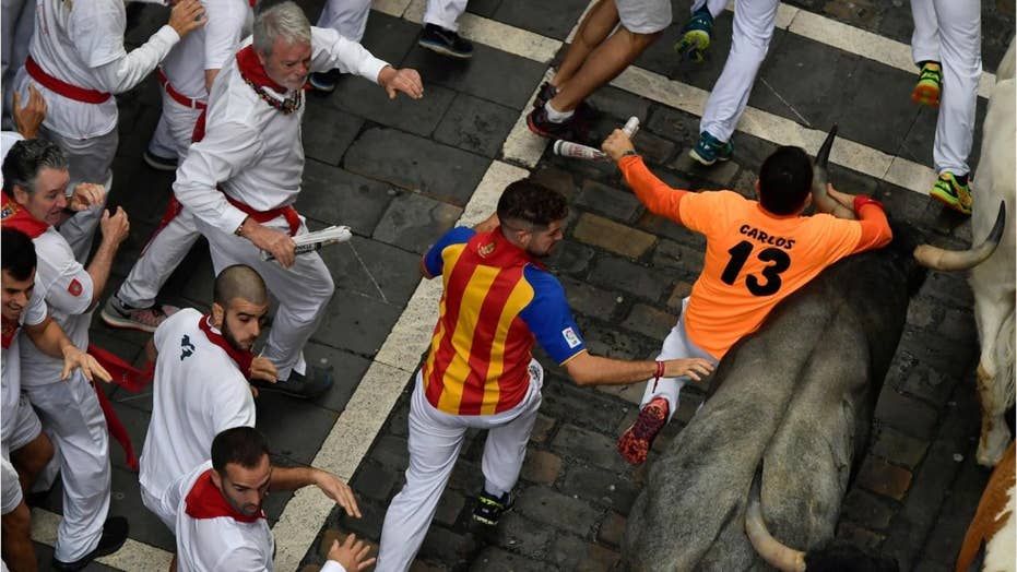 American man gored in the neck during Spain's running of the bulls said it felt ' like being hit