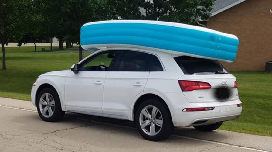 Mom caught cruising with 2 kids riding in an inflatable pool on top of her car
