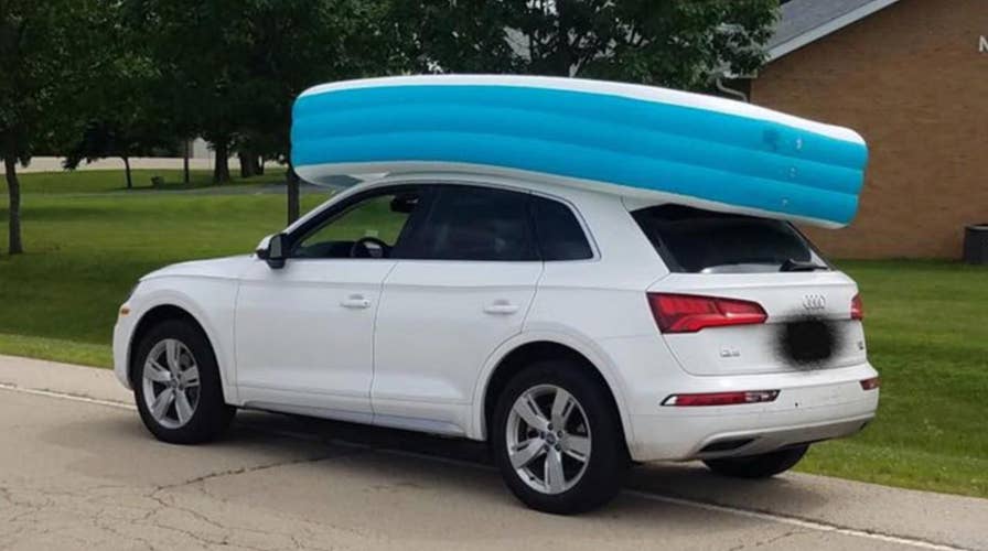 Mom caught cruising with 2 kids riding in an inflatable pool on top of her car