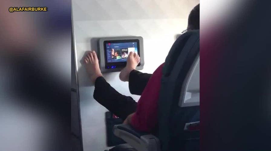 WATCH: Video of airline passenger operating screen with toes goes viral