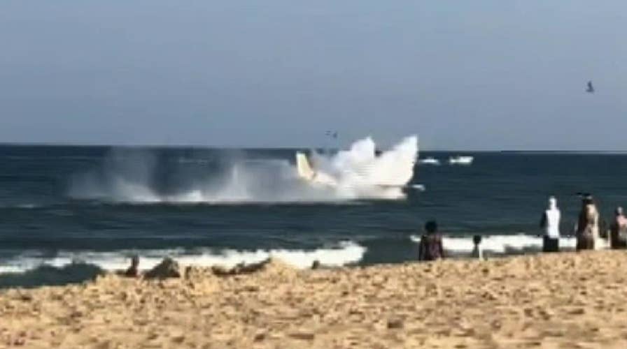 Raw video: A small plane makes an emergency water landing just offshore in Ocean City, Maryland