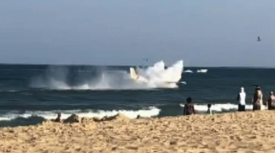 Raw video: A small plane makes an emergency water landing just offshore in Ocean City, Maryland