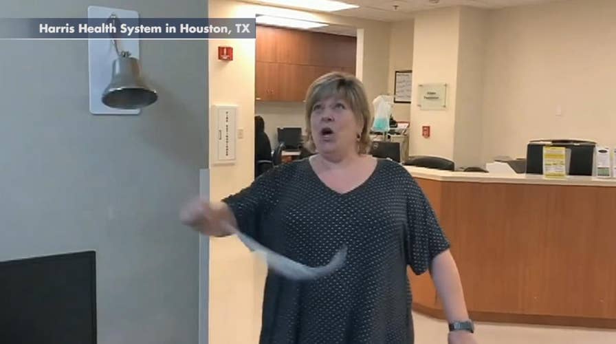 Excited patient breaks 'cancer free' bell after finishing last round of radiation treatment