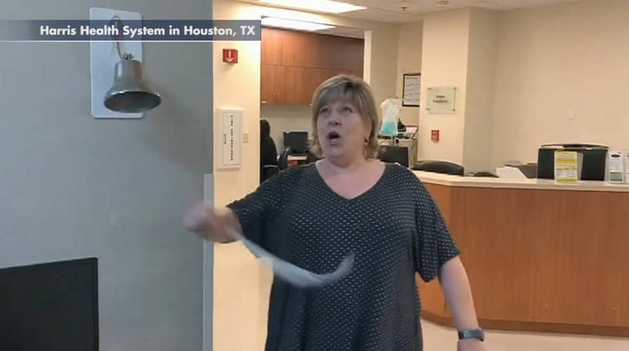 Excited patient breaks 'cancer free' bell after finishing last round of radiation treatment