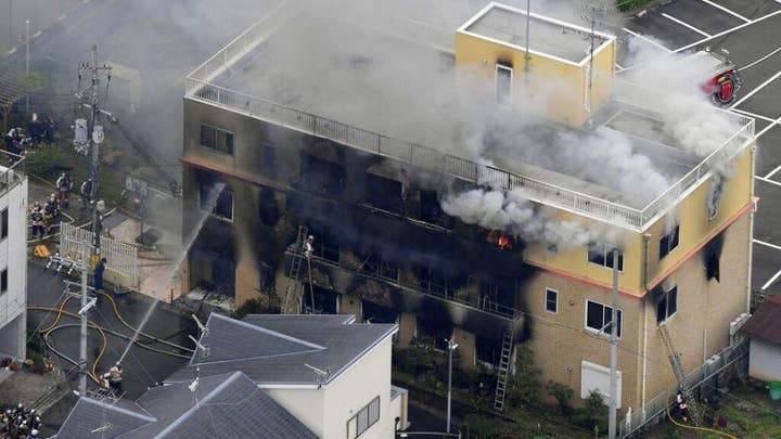 Man under arrest in Japan after fire leaves 33 people dead