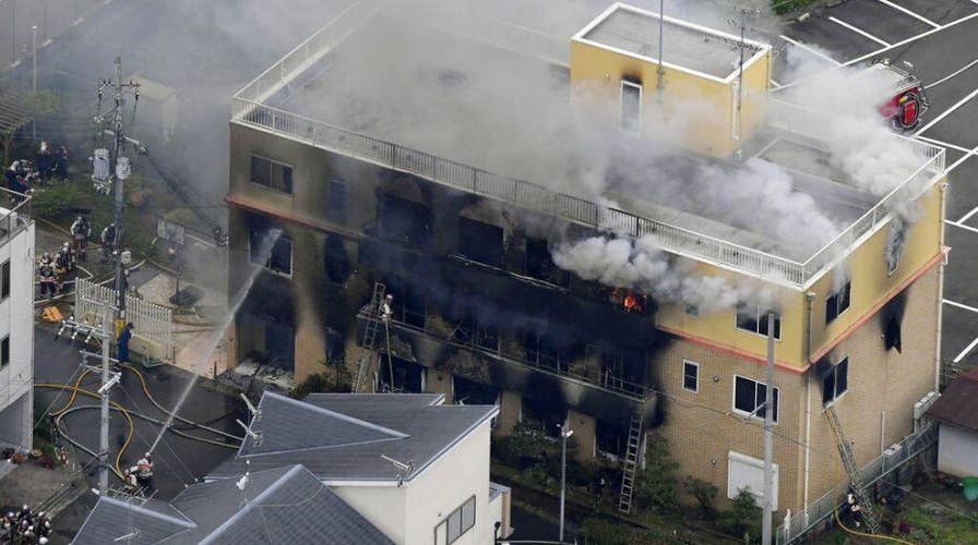 Man under arrest in Japan after fire leaves 33 people dead