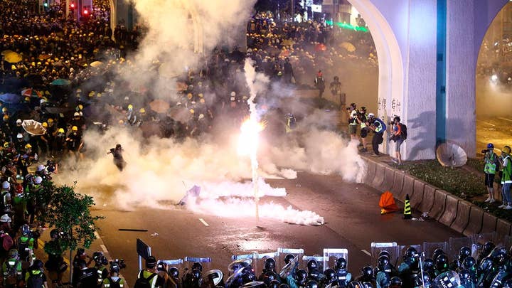Hong Kong police grapple with more pro-democracy demonstrators.
