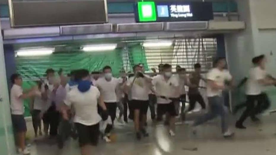 Hong Kong protests grow violent as masked assailants attack demonstrators, passengers at subway station Hong Kong protests grow violent as masked assailants attack demonstrators, passengers at subway station