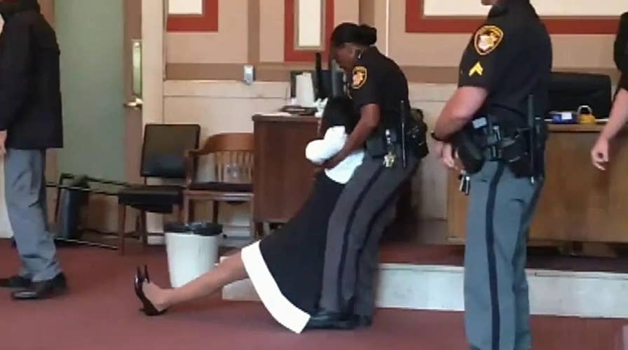 Raw video: Former judge is dragged out of the courtroom after being sentenced to jail